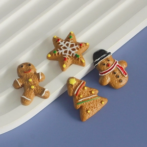 Miniature resin Christmas charms set featuring gingerbread man and tree on purple background
