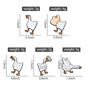 Detail view of 5 cute enamel swan pins with individual sizes and weights clearly marked
