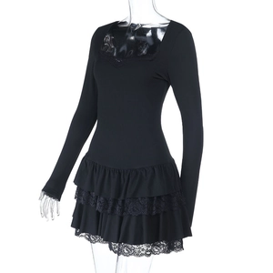 Detail of square neckline and ruffled tiered skirt on black long sleeve mini dress