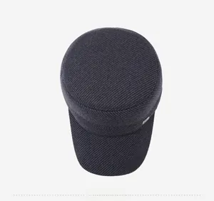 Bird's-eye view of a dark grey men's flat top cadet cap with thick twill texture and metal pin