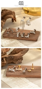 Close-up of G23 titanium Christmas tree piercing jewelry with micro-set zircon details