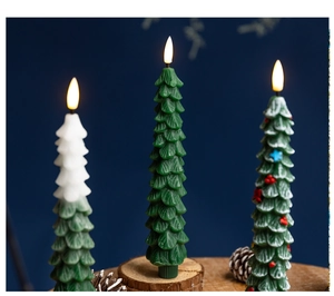 Detailed view of three Christmas tree-shaped LED candles on a wooden base decor