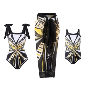 Three-piece family swimwear set with geometric patterns and mesh skirt in yellow and black