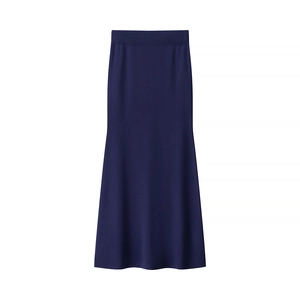 Detail shot of the knit texture and fishtail hem on this navy blue knitted skirt