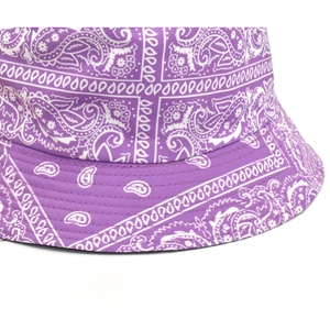 Close-up of purple paisley bucket hat with detailed stitching on reinforced canvas brim