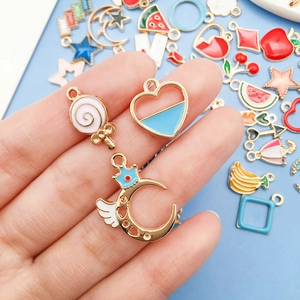 Macro shot of colorful enamel alloy charms like lollipops and hearts for DIY jewelry