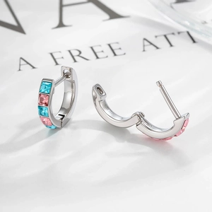 Silver geometric hoop earrings with teal and pink cubic zirconia in open and closed views