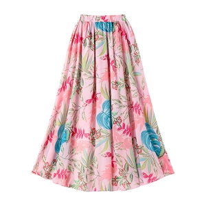 Detailed view of ruffle floral swimsuit with tropical leaf print and pleated waist design