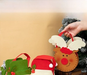 Detailed view of 20x15cm Christmas felt gift bag featuring Santa Claus and elk designs