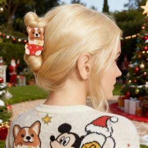 Cute Corgi dog in Christmas stocking hair claw clip worn by a model in a festive setting