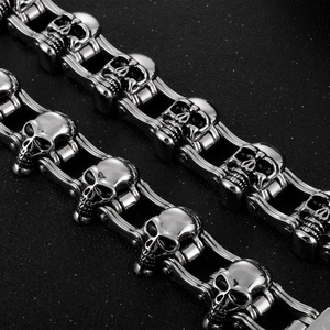 Macro detail of high-quality stainless steel motorcycle chain bracelet with skull relief