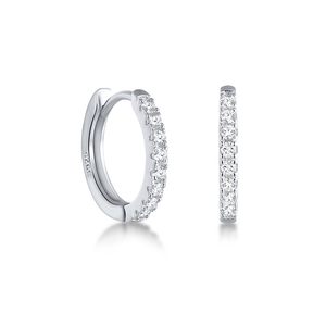 Macro detail of S925 sterling silver stamp and sparkling cubic zirconia pavé on hoop earring