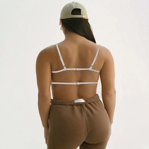 Detailed back view of white strappy camisole top with adjustable double shoulder straps