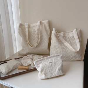 Beige floral lace tote bag set with matching cosmetic pouch and scrunchie accessory