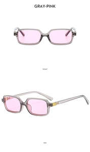 Detail view of vintage grey rectangular sunglasses with pink lenses and gold metal logo