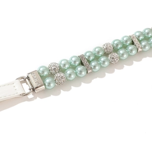 Close-up of double-row mint green faux pearl pet collar with luxury rhinestone spacers