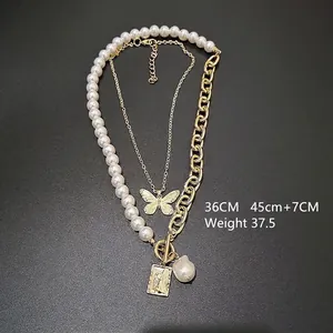 Detail view of layered baroque pearl and portrait medallion necklaces with 36CM and 45CM lengths