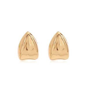 Macro view of gold-plated hip-hop grillz showing high-polished metallic fang details