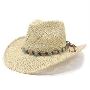 Ethnic western straw cowboy hat with turquoise bead band and hollowed out brim