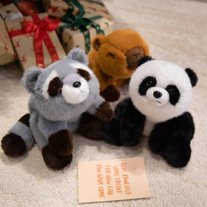 Plush panda, raccoon, and capybara stuffed animals set on a cozy rug for gift display