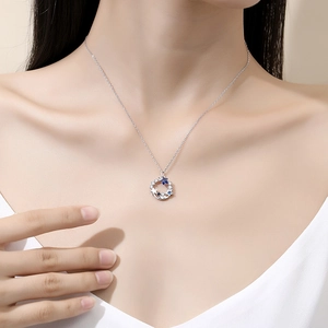 Elegant S925 sterling silver necklace with blue starry night pendant on model