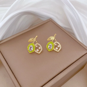 Elegant gold titanium necklace and earring set with pearls and green fruit motif