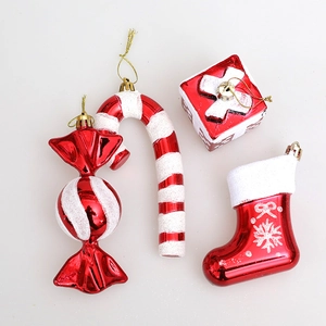 Christmas tree ornaments set with red and white candy canes, boots, and gift box pendants