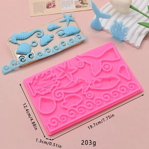 Pink silicone ocean theme mold with seahorse mermaid tail starfish and shells shapes