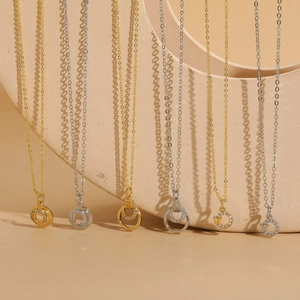 Minimalist geometric circle zircon necklaces in gold and silver finish on display