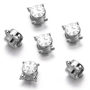 Macro shot of silver alarm clock shaped CCB spacer beads with engraved numeric clock face