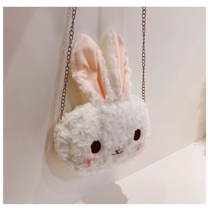 Detail of cute white plush rabbit bag showing soft fur texture and silver metal chain