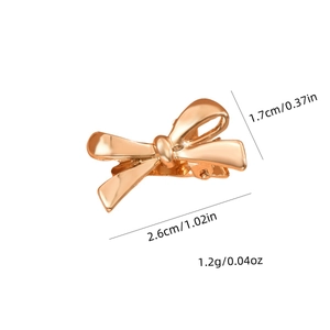 Polished rose gold metal bow hair clip with duckbill clip, measuring 2.6cm by 1.7cm