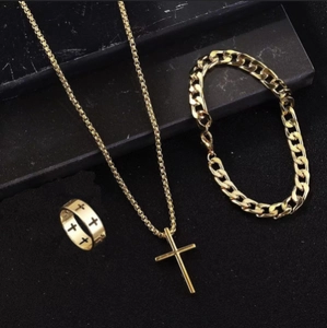 Detailed view of 3-piece gold cross jewelry set featuring necklace, bracelet and ring