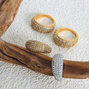 French style titanium steel rings set with Czech crystals on a natural wood block