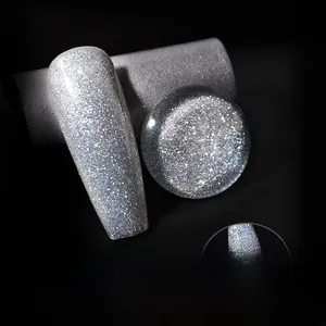 Macro shot of silver glitter nail polish gel with diamond-like shine on black background
