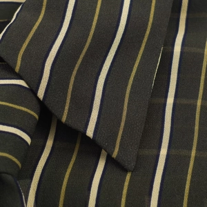 Detailed close-up of dark striped shirt fabric texture and woven vertical lines