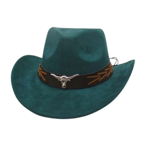 Detail of western cowboy hat with silver bull head emblem on brown leather band