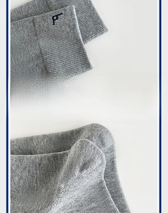 Detail of high-elasticity ribbed cuffs and P-letter embroidery on grey cotton socks