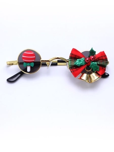 Detail of Christmas round gold metal glasses with plaid bow, bells and candy decor