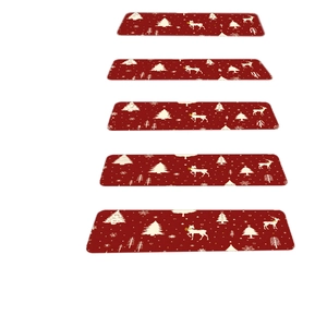 Set of 5 red Christmas stair mats with reindeer and snowflake patterns on white background