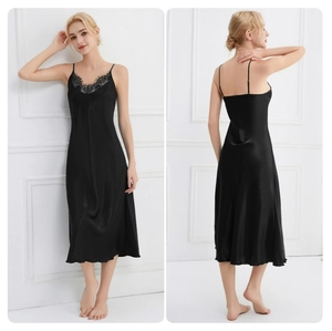 Detail view of black silk V-neck nightgown with delicate lace trim on front and back