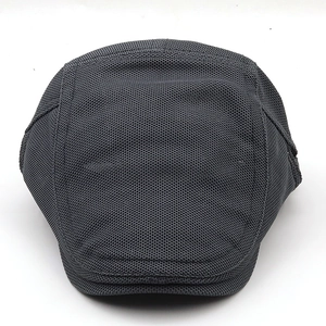 Detail of dark grey breathable mesh fabric and brim on the summer sun protection cap