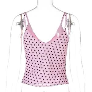 Detailed front view of pink polka dot mesh camisole with thin straps and V-neckline