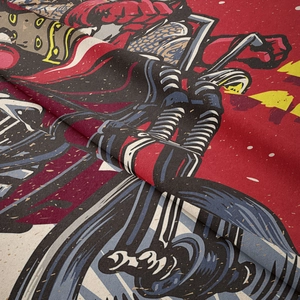 Close-up of vintage motorcycle tapestry fabric showing detailed weaving and vibrant prints
