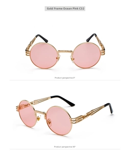 Detail view of steampunk round metal sunglasses with pink lenses and side spiral decor