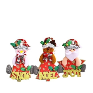 Set of three festive Christmas tree ornaments featuring Santa, Snowman, and Reindeer figures.