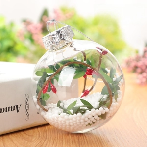 Detailed 8cm clear Christmas ball with red berries, green leaves and snow filling