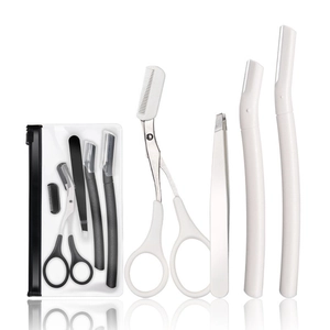 9-piece professional eyebrow grooming set with razors, tweezers and scissors in black and white
