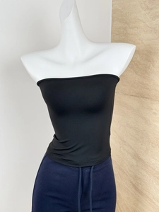Detailed texture of black elastic tube top on mannequin with skin-friendly fabric