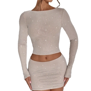 Women's sparkling rhinestone two-piece crop top and mini skirt set in champagne gold